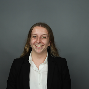 Allison Clunis Smiling in professional attire.